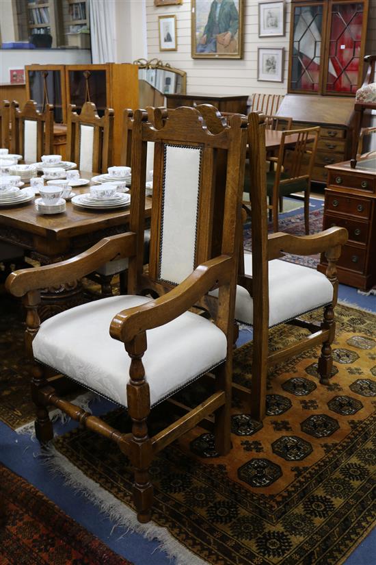 A set of 12 17th century style oak dining chairs